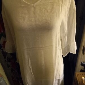 New,with tag white gauze beach coverup with ruffle hem & sleeves size medium.